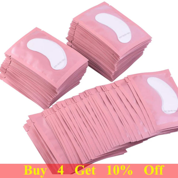 A stack of pink under-eye lash application patches is shown, with some patches laid out flat.
