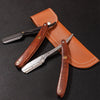 A leather sheath holds a wooden handle shaving razor and a metal straight razor.