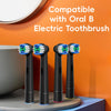Three replacement toothbrush heads for an Oral-B electric toothbrush displayed on a gray surface.