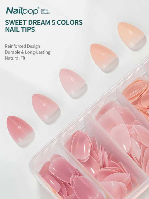 Una caja de uñas postizas Sweet Dream en 5 colores, incluyendo uñas prensadas de tonos rosa y nude.