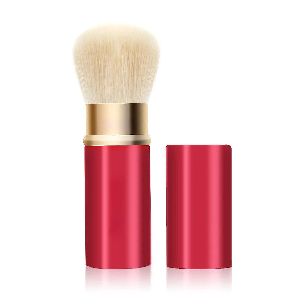 Set de pinceaux de maquillage rétractables avec une brosse blanche duveteuse et un étui cylindrique rouge.