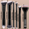 A set of six dual-ended makeup brushes with varying sizes and shapes shown standing upright.