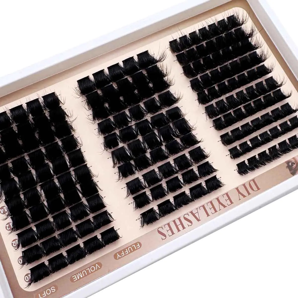 A tray of black eyelash clusters for DIY D-Curl styling, showing various lash types.