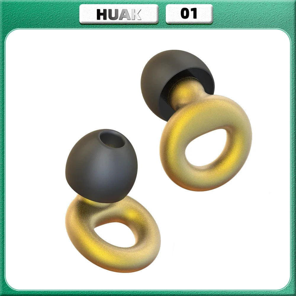 A pair of gold and black silicone ear plugs for noise reduction.