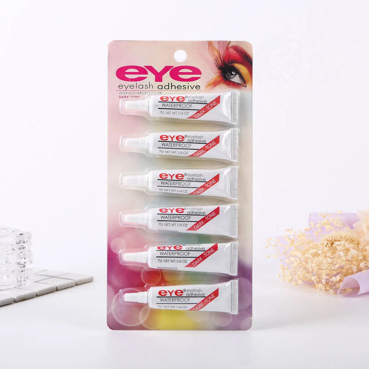 A package of eye eyelash adhesive waterproof glue for false lashes in a clear plastic blister pack.