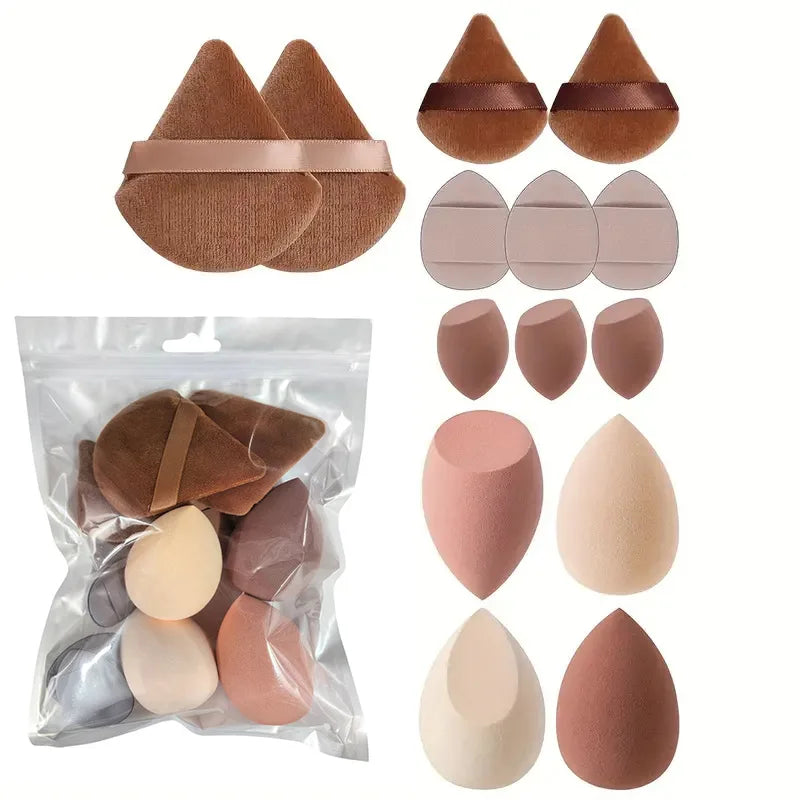 A set of professional makeup brushes in various shades of nude and pink, including flat and tapered shapes.