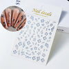 A sheet of blue floral nail decals featuring hibiscus flowers and other delicate designs for nail art.