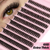 A close-up of pink lash clusters showing various styles of black false eyelashes.