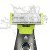 A close-up of a replacement electric shaver blade being used, with water splashing around the cutting area.