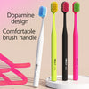 Three colored Mikofe brush handles showing different designs and colors on a white surface.