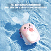 A pink electric toothbrush shaped like Sonic, floating in clear water.