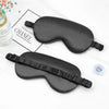 Black double-sided silk eye mask for sleep and relaxation displayed on a white background.
