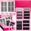 A pink DIY eyelash extension kit showing various lash clusters, adhesive, and tweezers.