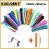 A collection of colorful orthodontic elastic ligature ties or tooth ties in various shades and sizes.