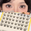 Close-up of a model's eye showing no glue eyelash extensions laid out on a sheet.