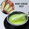 Constructeur en gel vert bébé JN22 taille M pour extensions à ongles, montré dans un pot et sur un ongle.