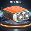Orange and silver mini electric shaver with dual rotating heads shown on a circular base.