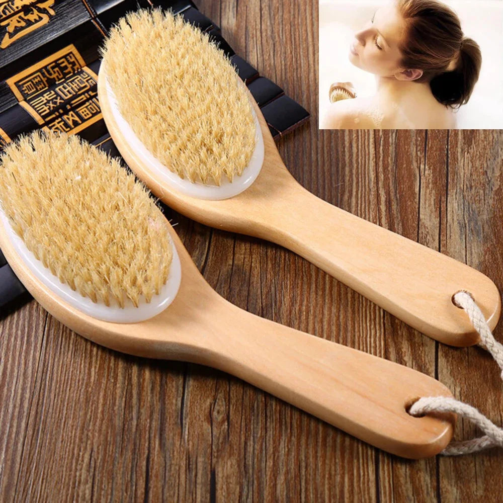 A wooden body brush with natural bristles is shown on a wooden surface next to a woman using it for dry brushing.