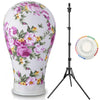 Tête de perruque professionnelle avec motif floral et support noir réglable.