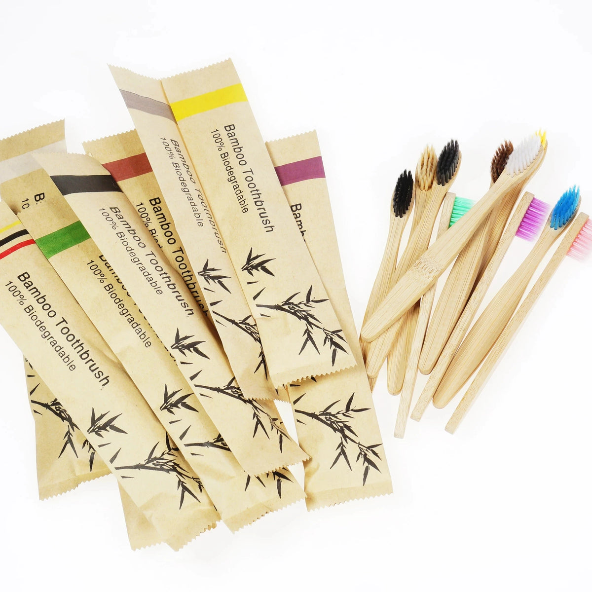 A pack of ten bamboo toothbrushes with soft bristles in various colors and natural wood handles.