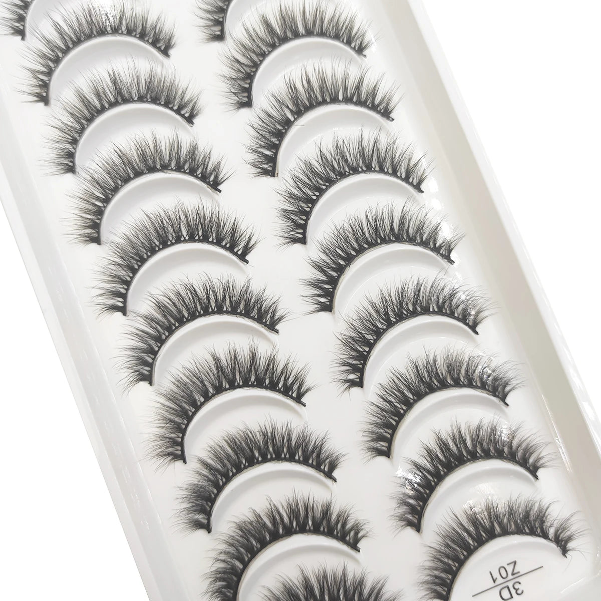 A tray of natural 3D mink false eyelashes in various styles and lengths.