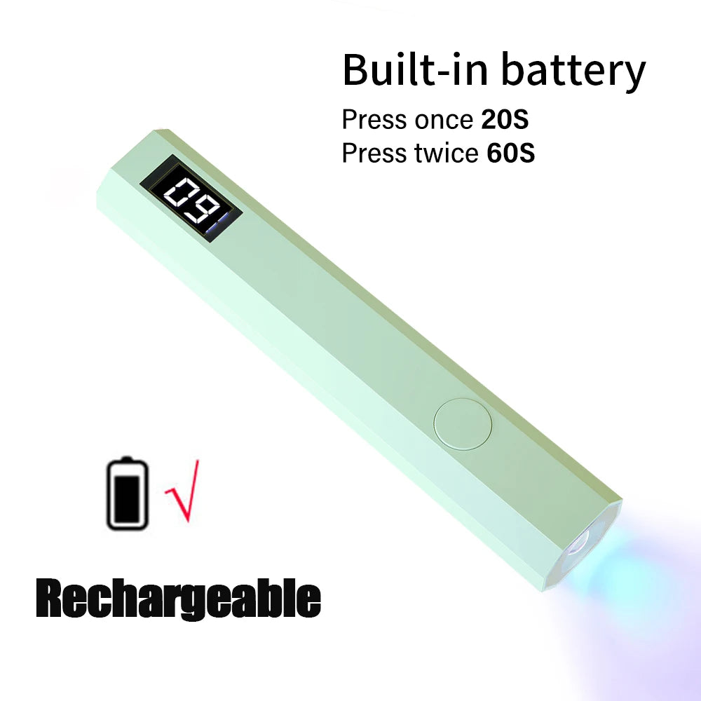 A light green portable UV nail lamp with an LCD display and a rechargeable battery icon.