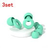 A set of three light green silicone ear plugs shown on a white surface.