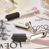 A beige folding pocket hair comb with a mirror and scalp massage cushion is shown on a white surface.