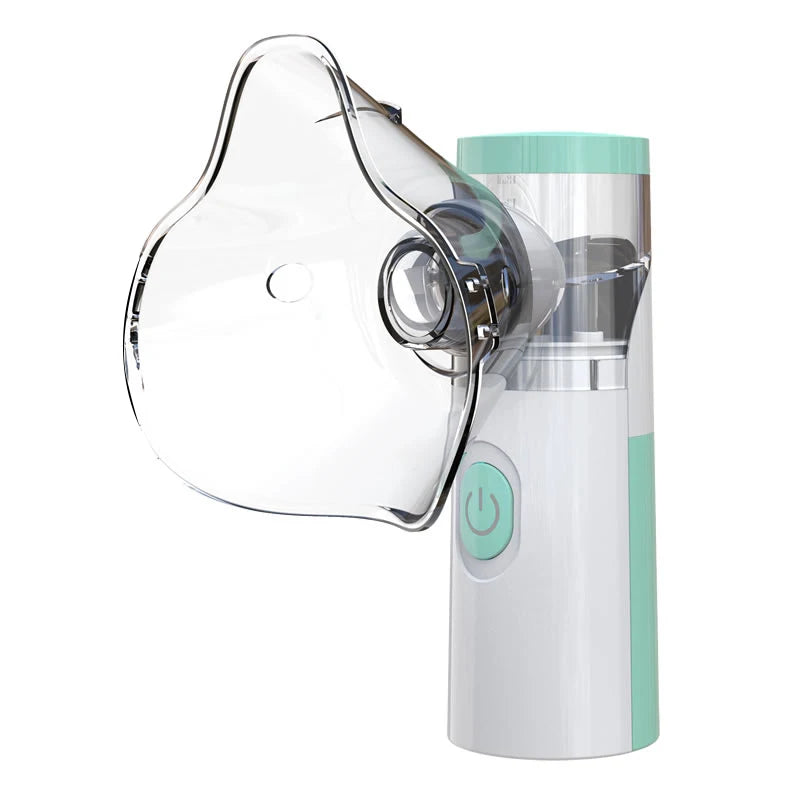 A clear portable mesh nebulizer device with a white and mint green body is shown from the side.
