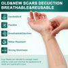 A hand is applying a clear silicone scar sheet to a person's arm for scar management.
