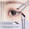 A close-up of various ultra-thin angled eyeliner brushes and applicators for precise makeup application.