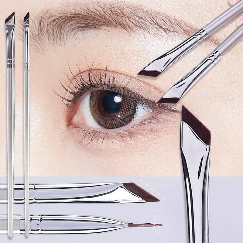 A close-up of various ultra-thin angled eyeliner brushes and applicators for precise makeup application.