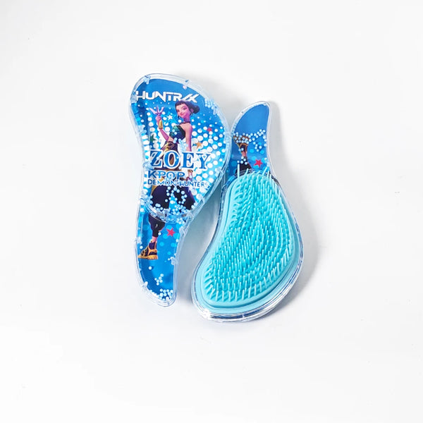 A blue and pink KPop Demon Hunter massage comb with a silicone head is shown on a white background.