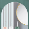 Multiple colors of an oral irrigator including white, green, and pink models displayed in a bathroom setting.