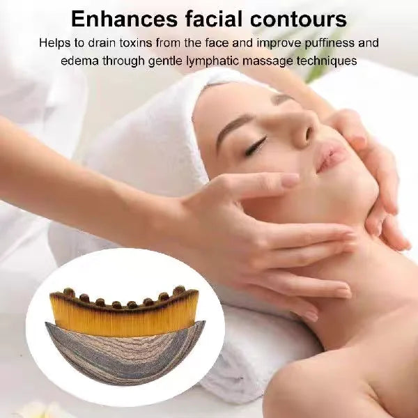 A person is receiving a facial massage treatment using a golden lymphatic contour face brush on their face.
