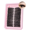 A pink plastic lash tray containing natural wispy lash clusters for decorating beauty.
