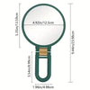 A magnifying fold-up handheld vanity mirror with a green frame and a round glass lens.