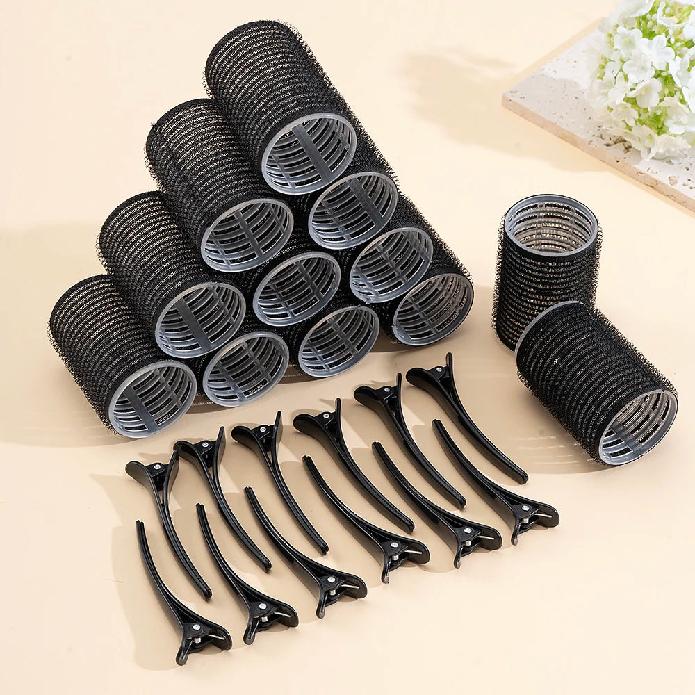 A set of black self-grip hair rollers for creating heatless curls and volume, displayed on a light background.