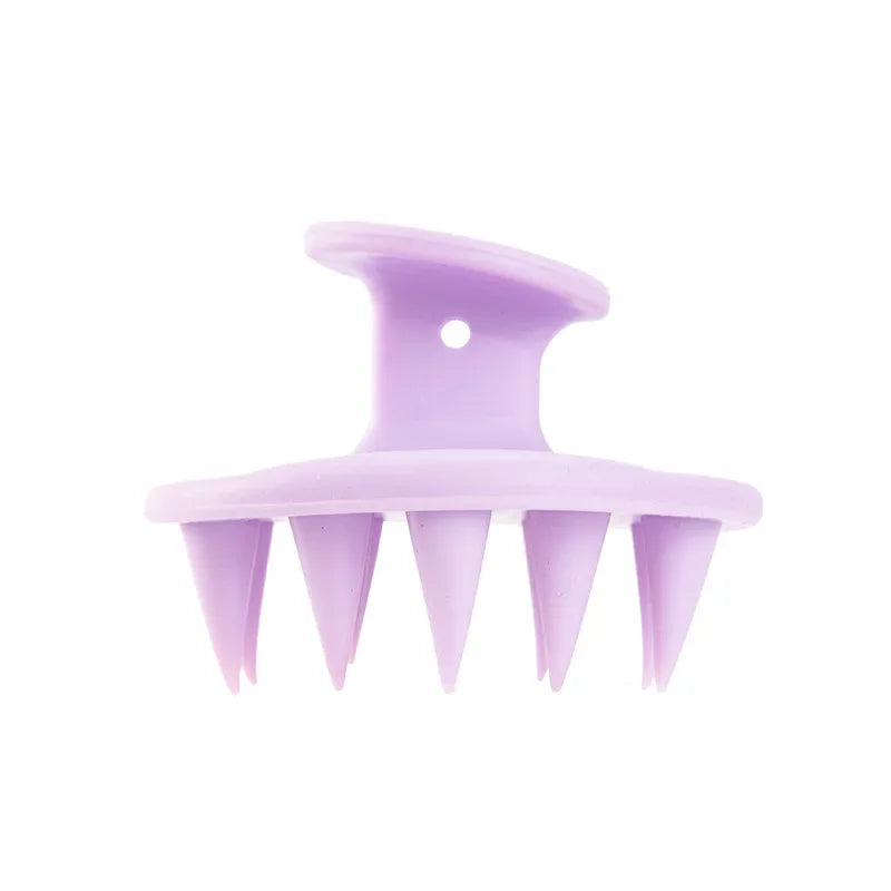 Brosse de massage portable en silicone violet avec plusieurs pointes pour le soin du cuir chevelu et des cheveux.