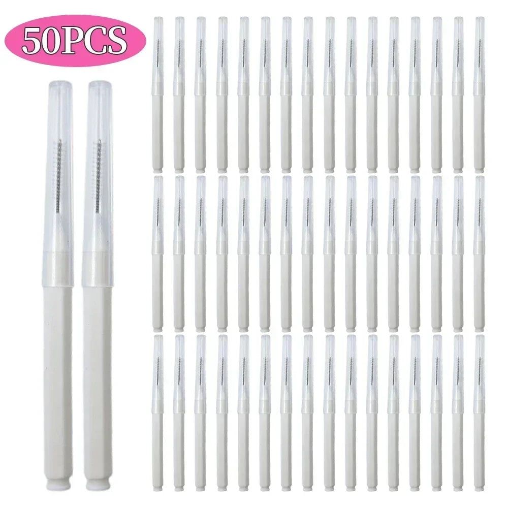 A set of 50 mini brow and eyelash combs in white.