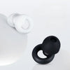 A pair of white silicone earplugs resting on a white surface.