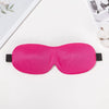 A bright pink 3D sleep mask designed for light blocking is displayed on a white surface.