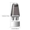 A clear precision scalp oil applicator bottle with a ball-tip massager and a white base.
