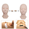 A realistic silicone mannequin head showing the application of eyelash extensions for practice.