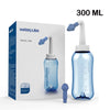 A clear plastic nasal irrigation rinse bottle with a white and blue nozzle is shown next to its packaging.