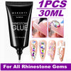 Black tube of Makartt Rhinestone Glue for nail art featuring various gemstone designs on nails