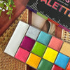 A collection of 20 vibrant, non-toxic body paint colors arranged in a square palette.