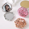 A set of vintage rose design double-sided pocket makeup mirrors in pink and rose gold tones.