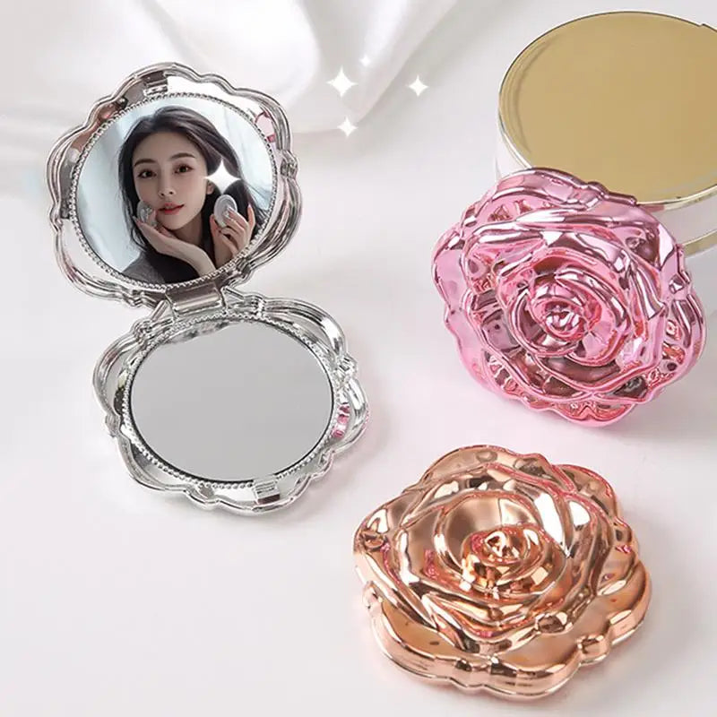 A set of vintage rose design double-sided pocket makeup mirrors in pink and rose gold tones.