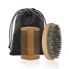 A black mesh bag containing a wooden boar bristle beard and mustache comb set.